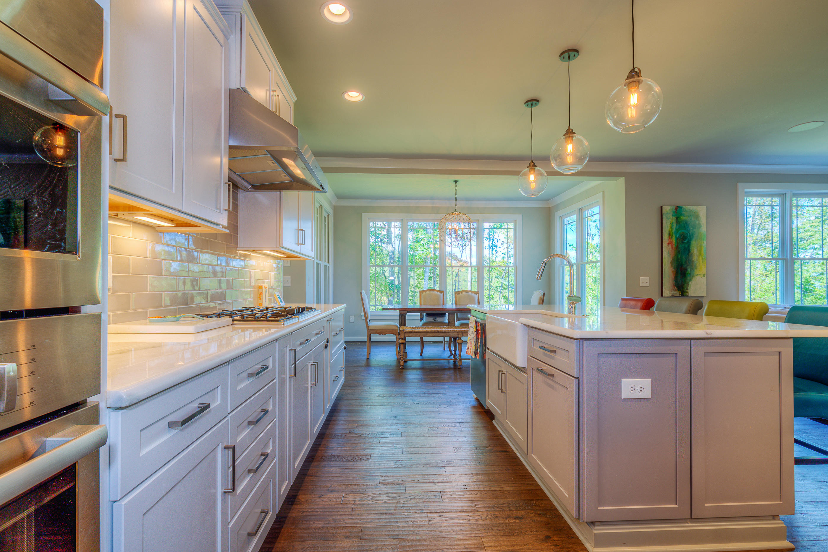 6910 Fairway Ridge Road Salem, VA 24153 - Photo 5 of 46 a large kitchen with kitchen island wooden floors and stainless steel appliances