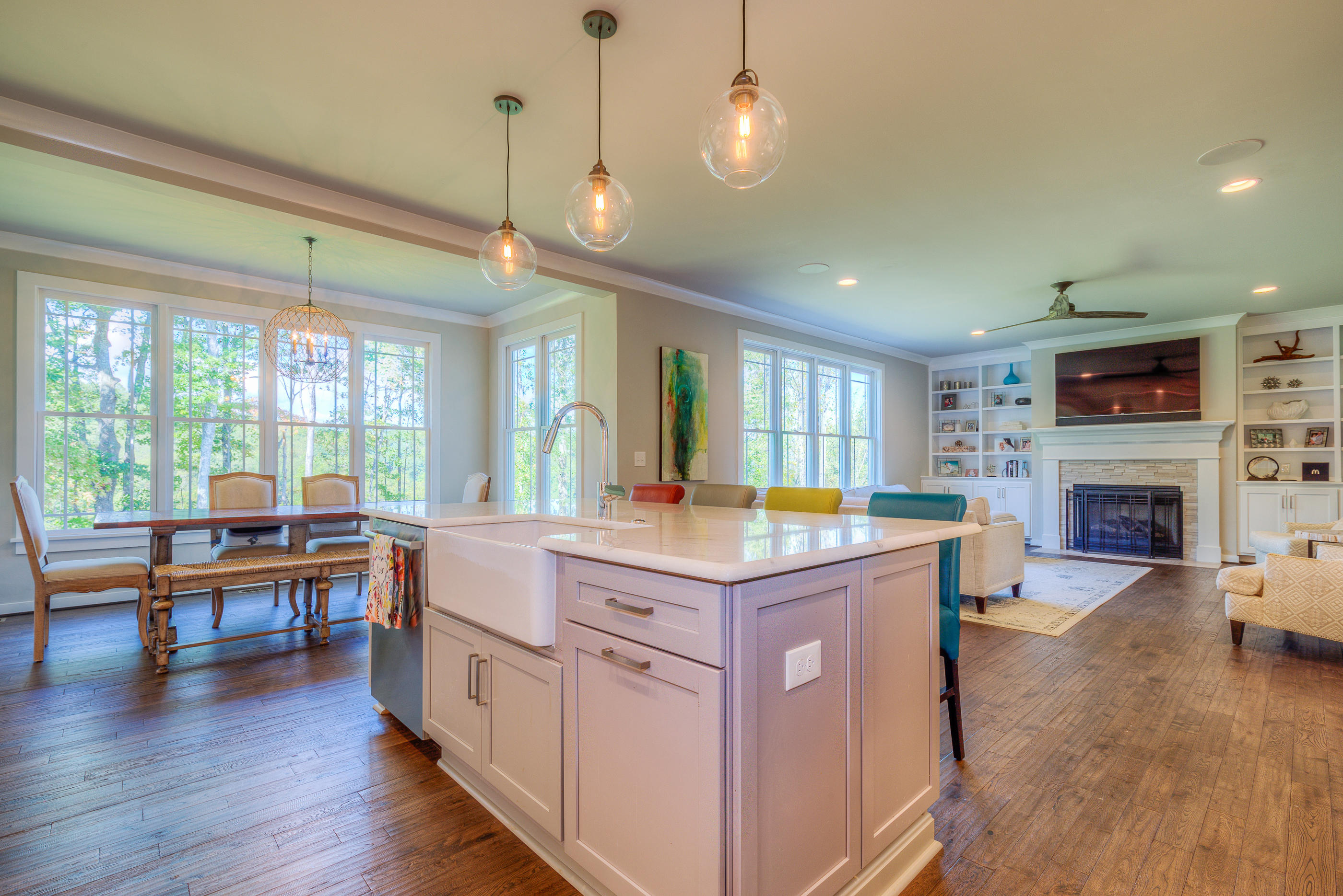 6910 Fairway Ridge Road Salem, VA 24153 - Photo 7 of 46 a large kitchen with kitchen island granite countertop a stove and a wooden floors
