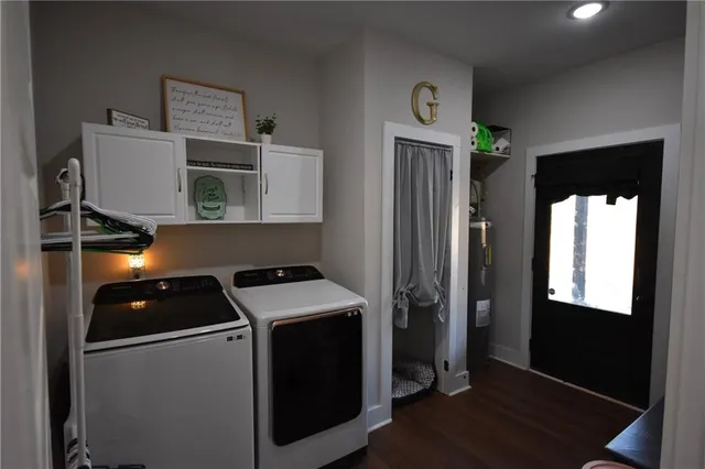 a utility room with dryer and washer