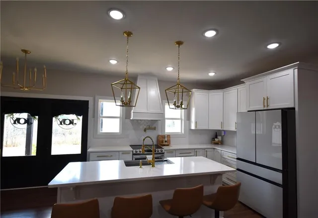 a kitchen with refrigerator and window