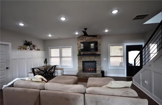 a living room with furniture and a fireplace