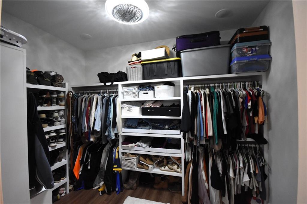 533 Lively Road Waco, GA 30182 - Photo 26 of 41 a view of walk in closet with clothes and shoes