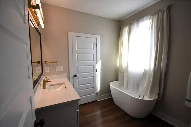 a bathroom with a sink and mirror