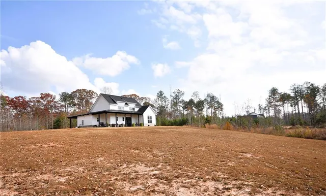 a view of house with outdoor space