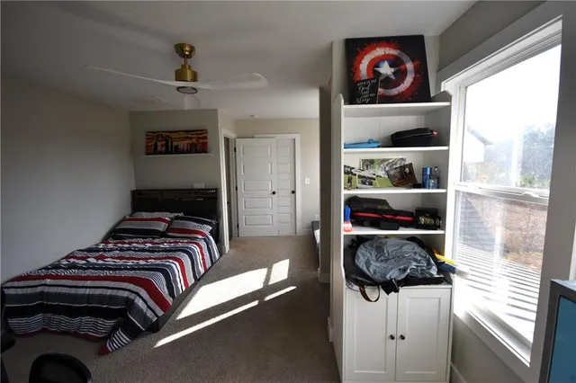 a bedroom with a bed and closet