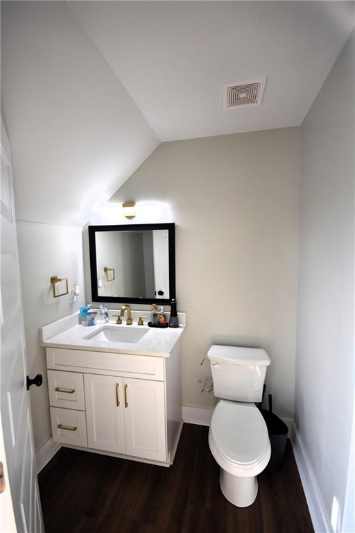 533 Lively Road Waco, GA 30182 - Photo 37 of 41 a bathroom with a toilet sink a mirror and vanity