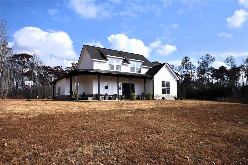 533 Lively Road Waco, GA 30182 - Photo 5 of 41 a view of a large house with a street