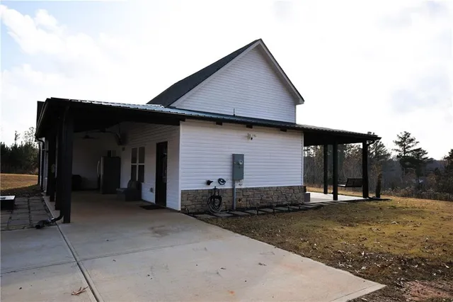 a front view of a house with barbeque
