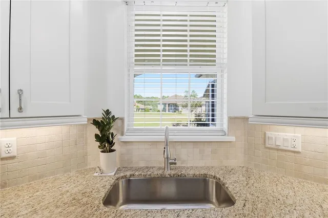 a kitchen with a sink and a window