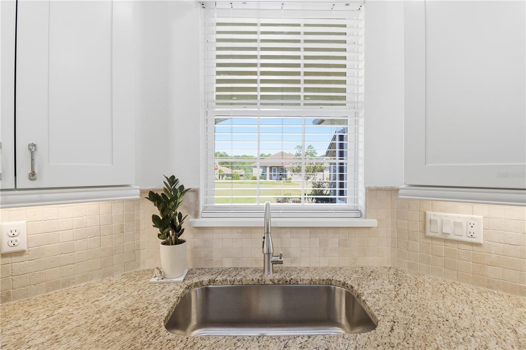 5470 West Hunter Run Lane Homosassa, FL 34446 - Photo 12 of 46 a kitchen with a sink and a window