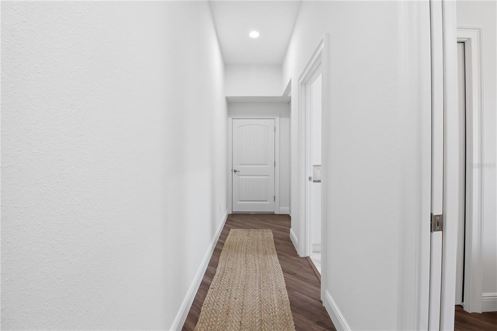 5470 West Hunter Run Lane Homosassa, FL 34446 - Photo 23 of 46 a view of a hallway with wooden floor