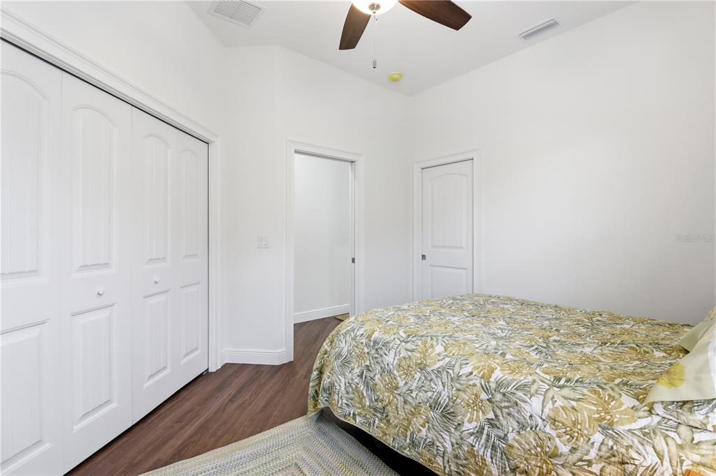 5470 West Hunter Run Lane Homosassa, FL 34446 - Photo 24 of 46 a bedroom with a bed and painted walls