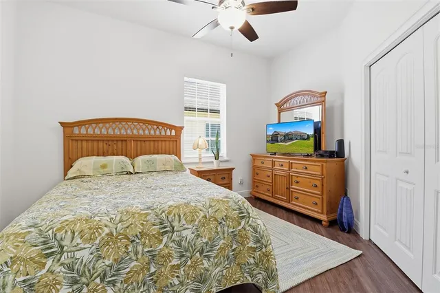 a bedroom with a bed and a dresser in it