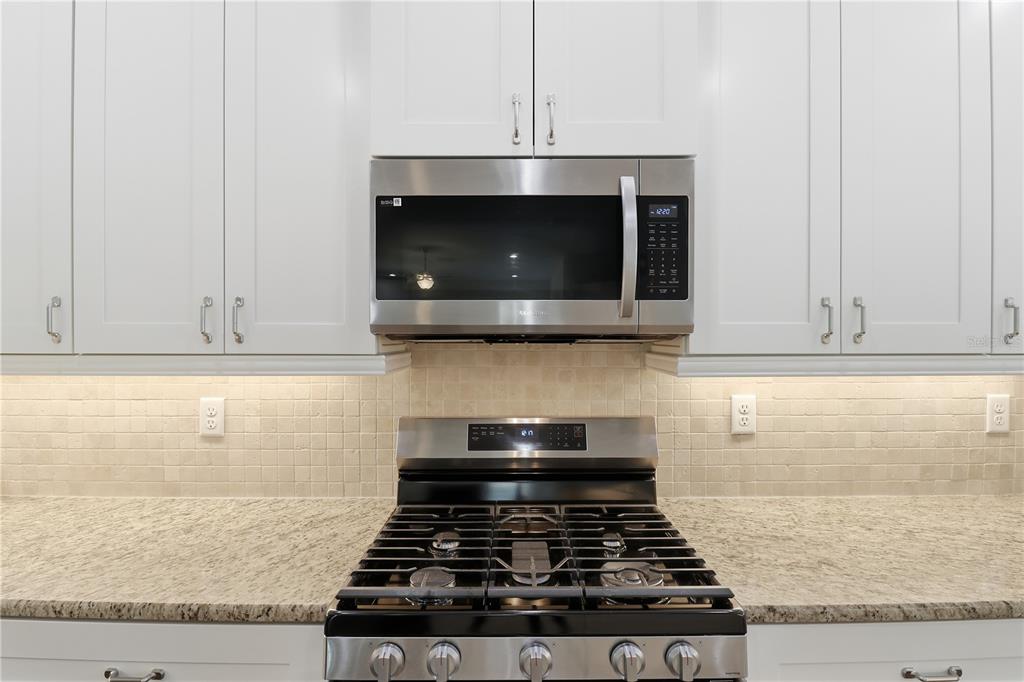 5470 West Hunter Run Lane Homosassa, FL 34446 - Photo 37 of 46 a stove top oven sitting inside of a kitchen