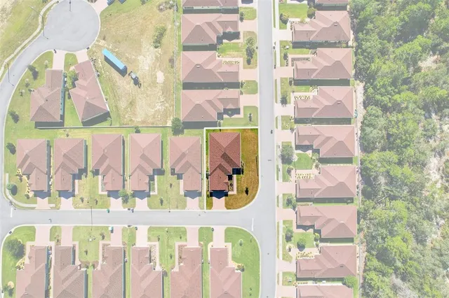 a view of swimming pool with outdoor seating and yard