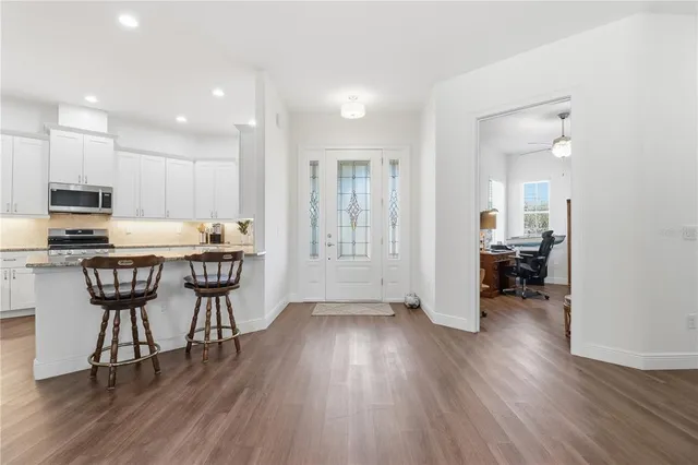 a kitchen with a table and chairs in it