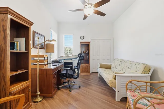 a view of a livingroom with furniture and workspace