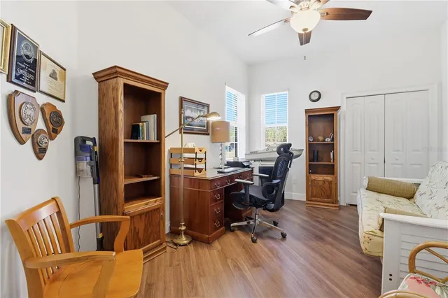 a view of a workspace with furniture and a living room