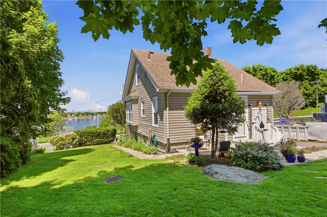 1536 Main Road Tiverton, RI 02878 - Photo 31 of 34 Backyard offers landscaped stonewalls and path, mature perennial gardens, plenty of shade and sunlight, large parking area and a slate patio