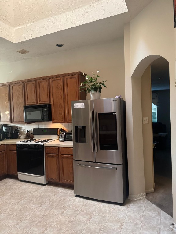 11126 Riverbank Ridge Lane Houston, TX 77089 - Photo 6 of 8 a kitchen with stainless steel appliances granite countertop a refrigerator and a stove
