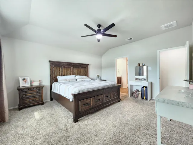 a bed room with a bed and dresser