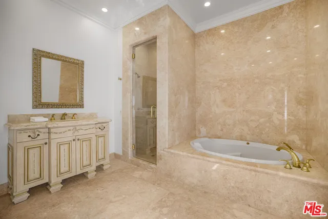 a living room with furniture and large windows