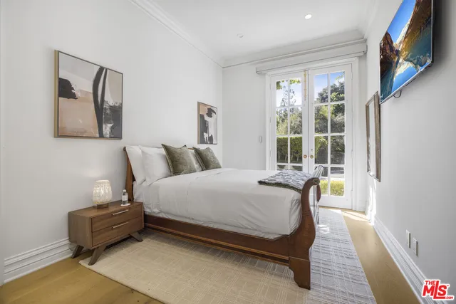 a view of a livingroom with furniture and a potted plant