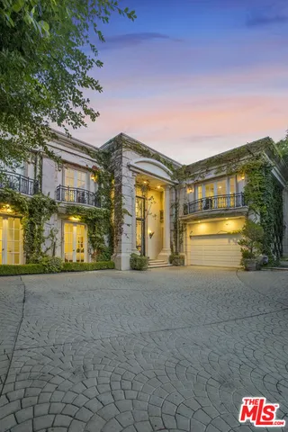 a living room with fireplace furniture and a flat screen tv