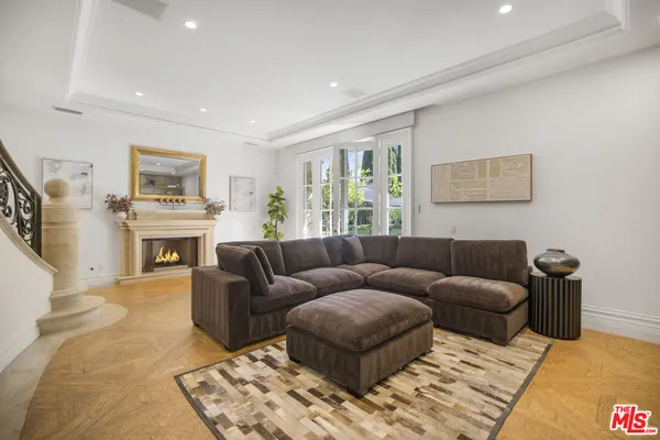 a view of a workspace with a table and a bedroom