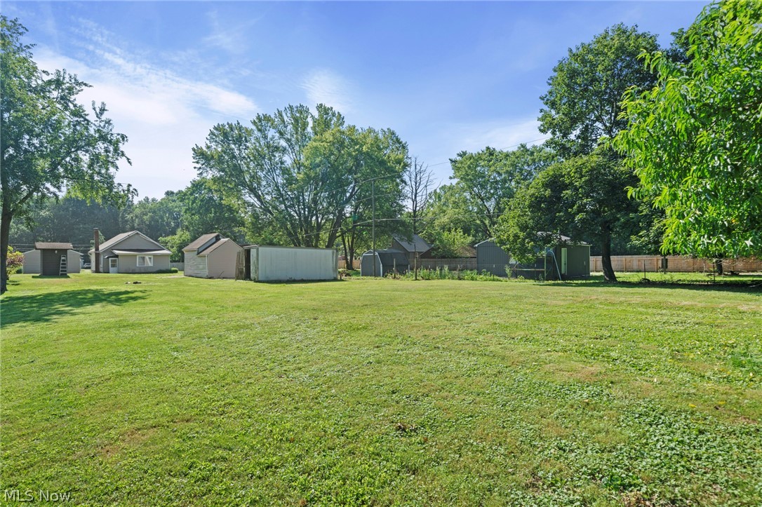 1218 Briggle Road Akron, OH 44320 - Photo 31 of 40 Expansive grassy yard with mature trees