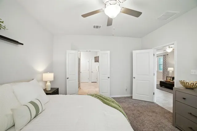 a bathroom with a shower and a sink