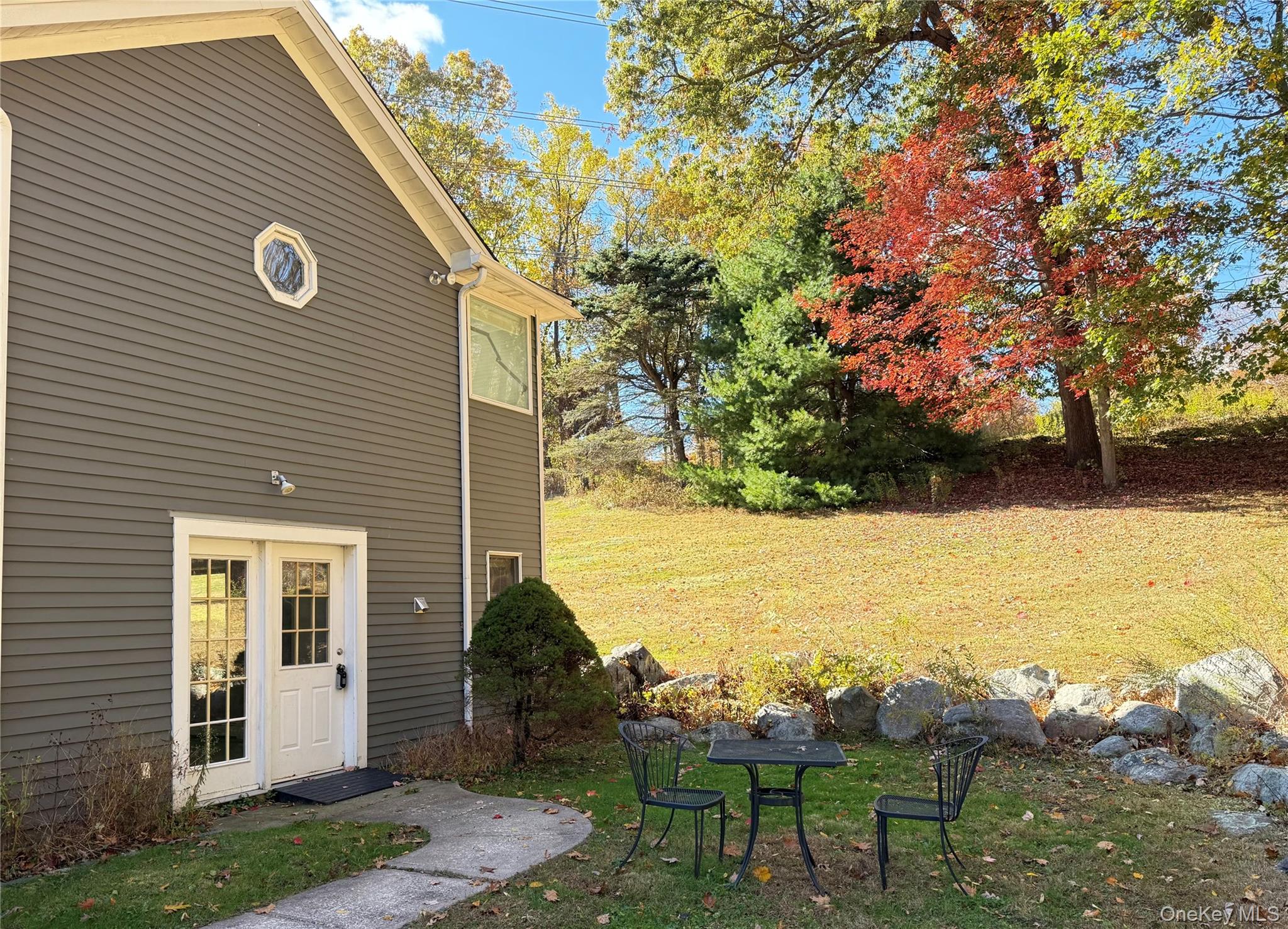 25 Valley Road Pleasantville, NY 10570 - Photo 1 of 10 a view of a terrace with yard and wooden fence