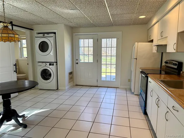 a view of a storage & utility room with a washer dryer
