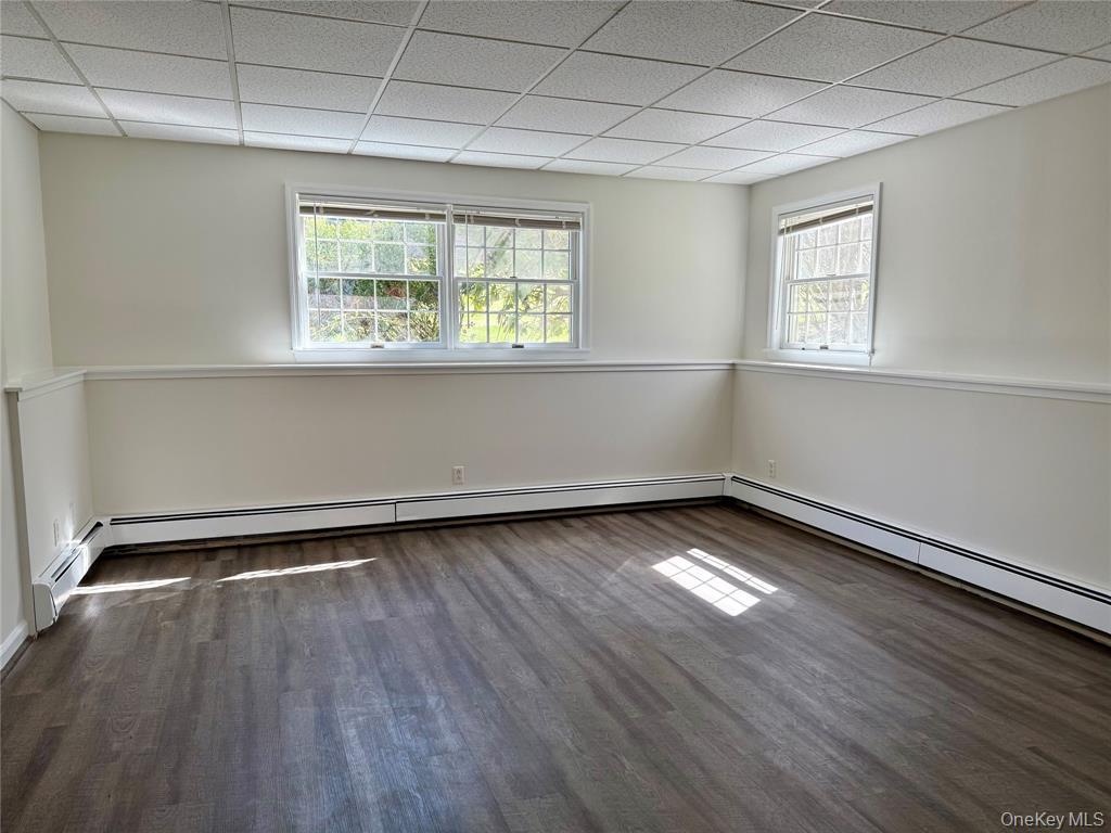 25 Valley Road Pleasantville, NY 10570 - Photo 7 of 10 an empty room with wooden floor and windows