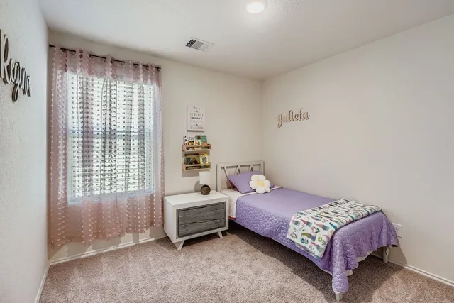 a view of a house with a backyard and a patio