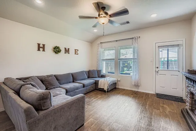 a living room with furniture and a large window