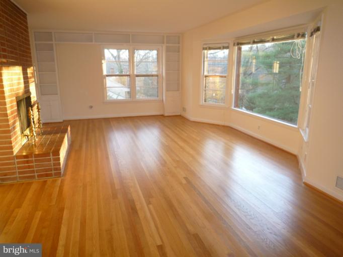 7207 Fort Hunt Road Alexandria, VA 22307 - Photo 8 of 15 a view of empty room with wooden floor and fan