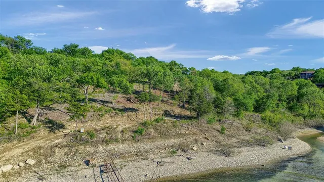 a view of a big yard with lots of green space