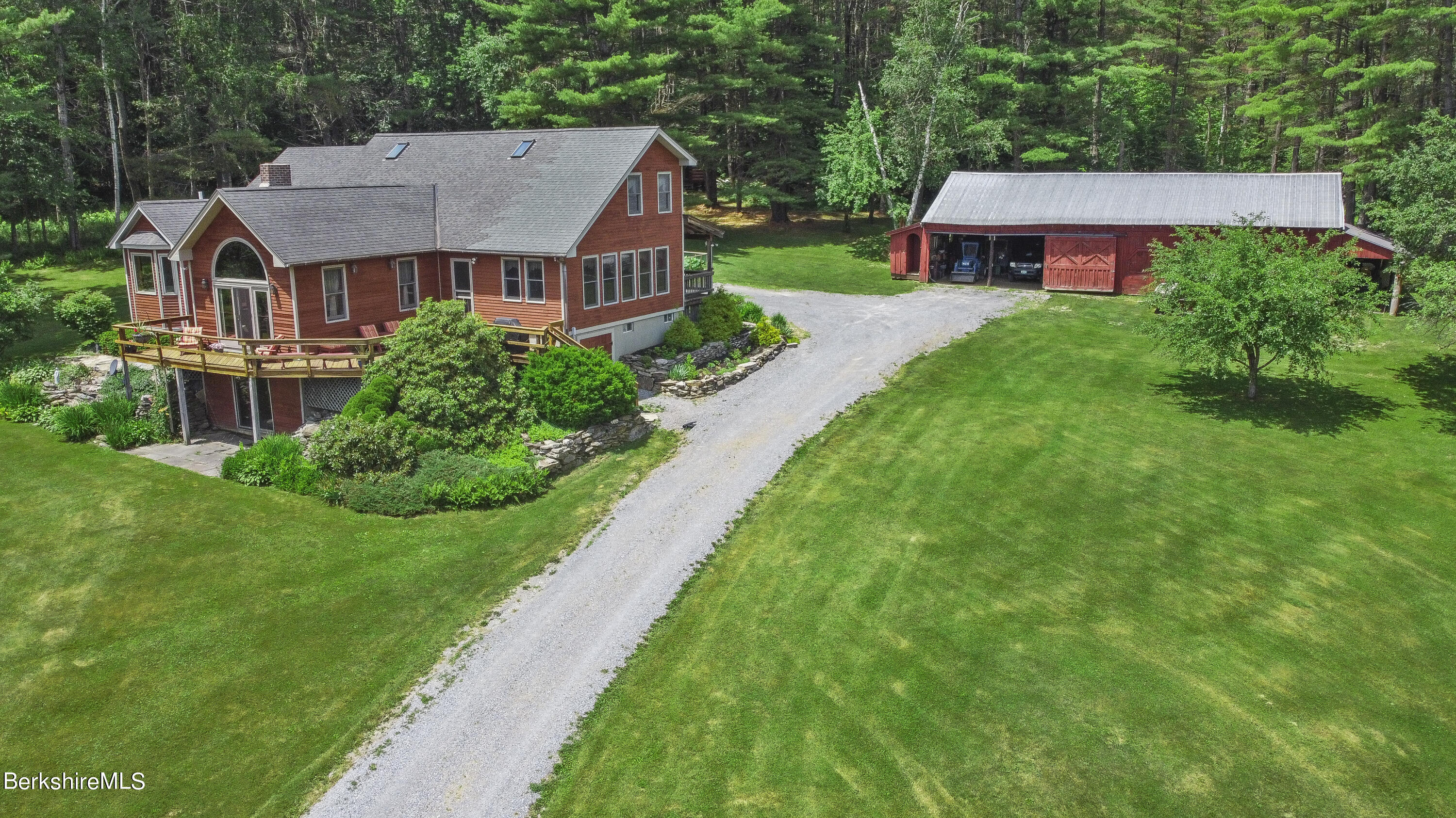 3025 Mt Anthony Road Bennington, VT 05201 - Photo 17 of 54 a aerial view of a house next to a big yard and large trees