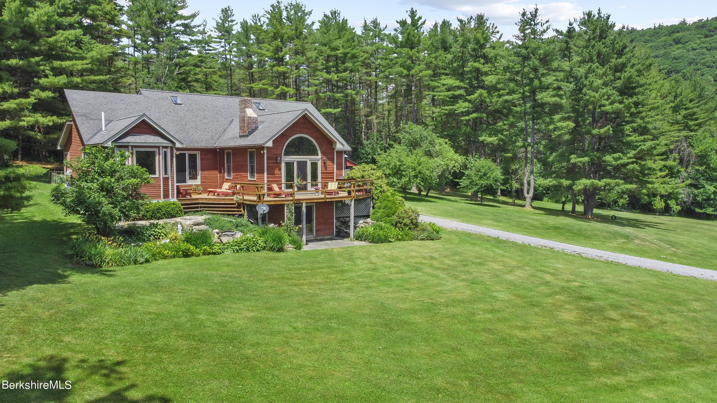 3025 Mt Anthony Road Bennington, VT 05201 - Photo 2 of 54 a front view of a house with a yard and trees