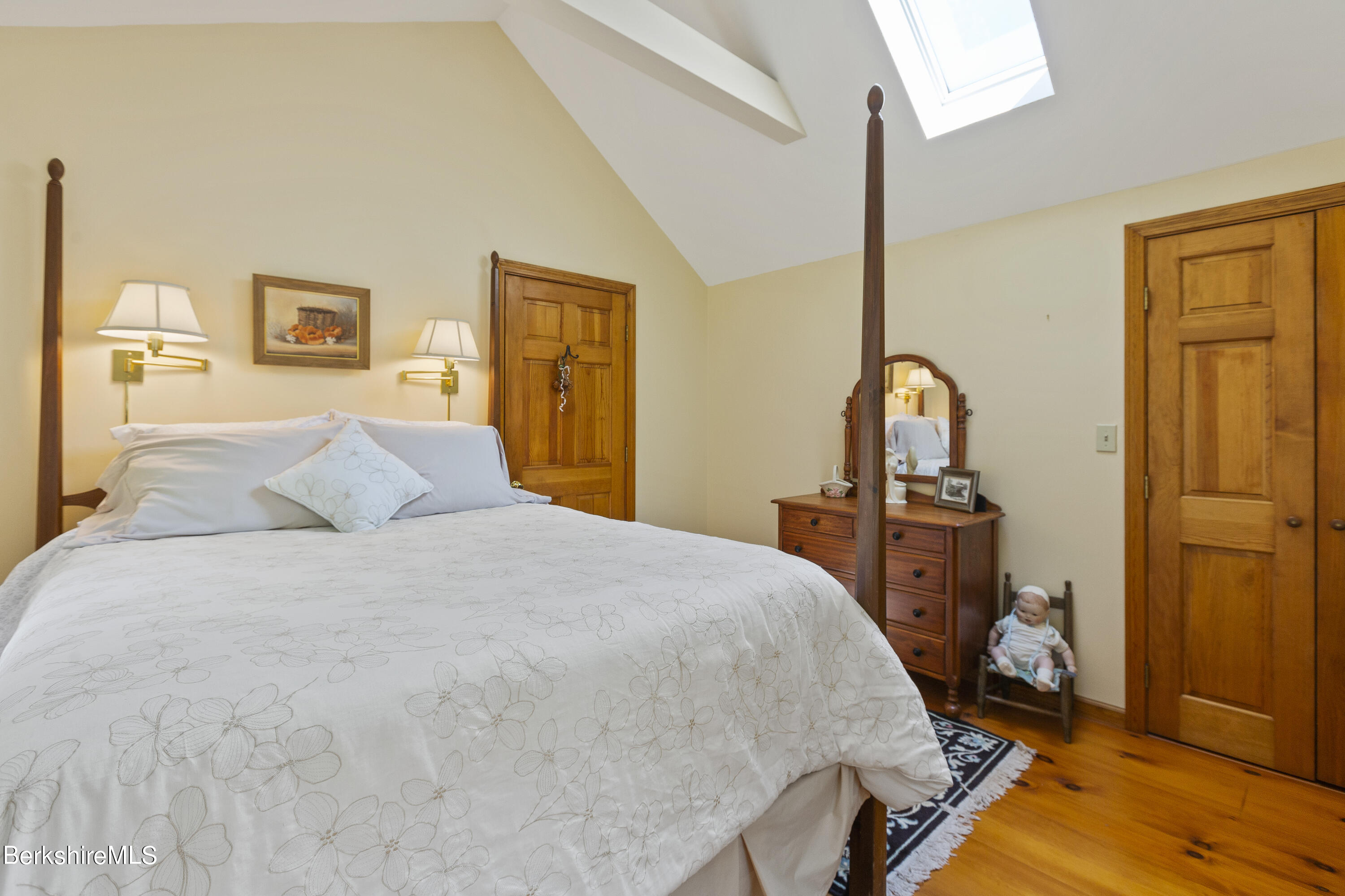 3025 Mt Anthony Road Bennington, VT 05201 - Photo 41 of 54 a bedroom with a bed and wooden floor