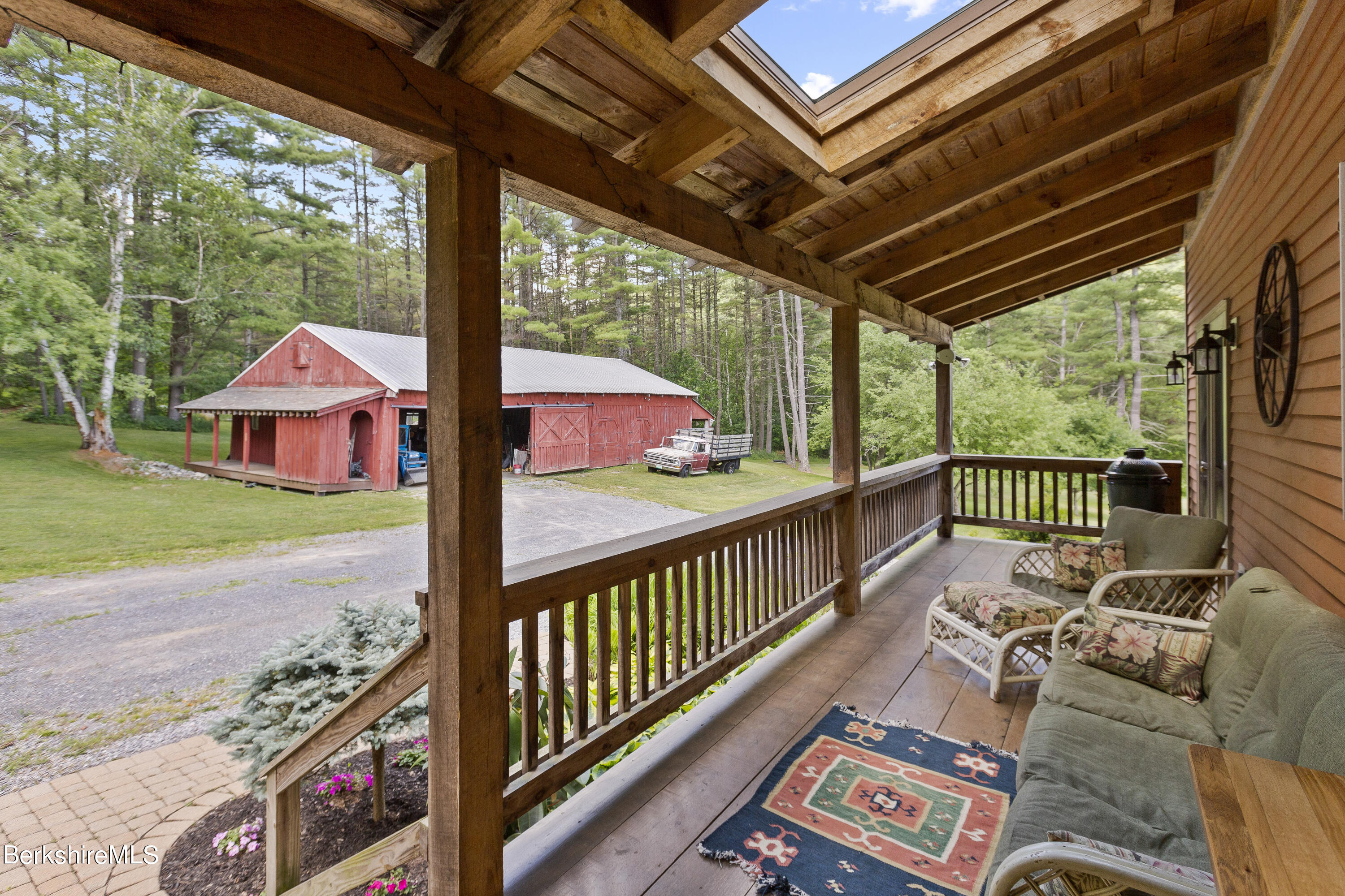 3025 Mt Anthony Road Bennington, VT 05201 - Photo 5 of 54 a view of a patio with couches chairs and wooden floor