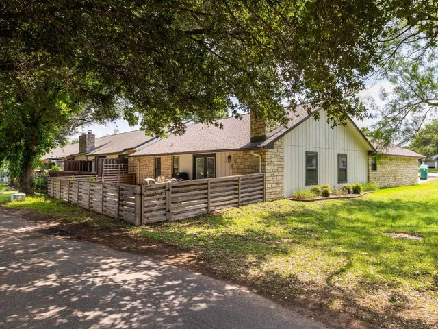 a view of a patio with table and chairs and wooden floor