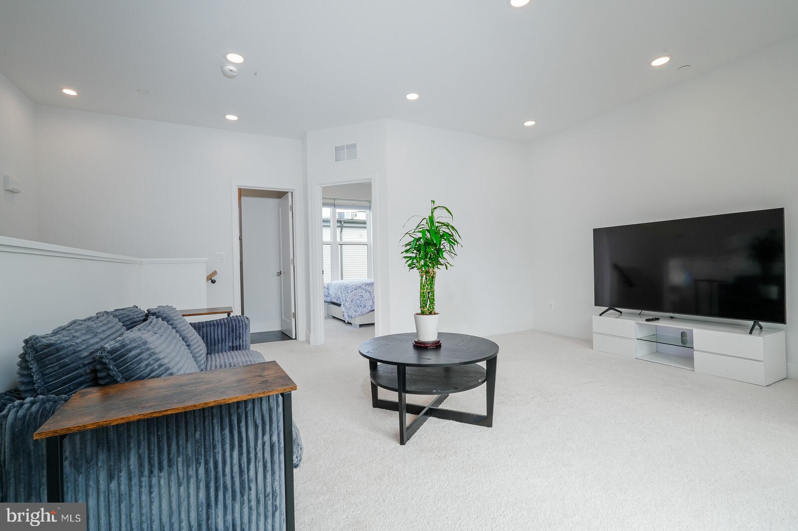 5345 Zenith Overlook Bethesda, MD 20816 - Photo 46 of 53 a living room with furniture and a flat screen tv
