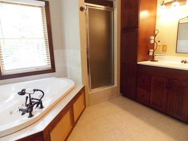 74 Monson Road Brimfield, MA 01010 - Photo 23 of 29 a bathroom with a tub sink and mirror