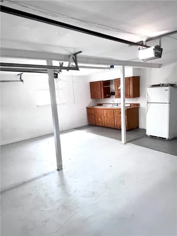 a room with a bed and a large window