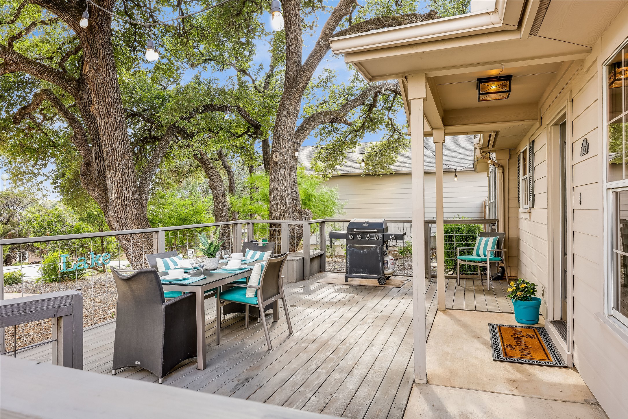 426 Summit Ridge Drive North Point Venture, TX 78645 - Photo 4 of 28 a view of a balcony with chairs and wooden fence