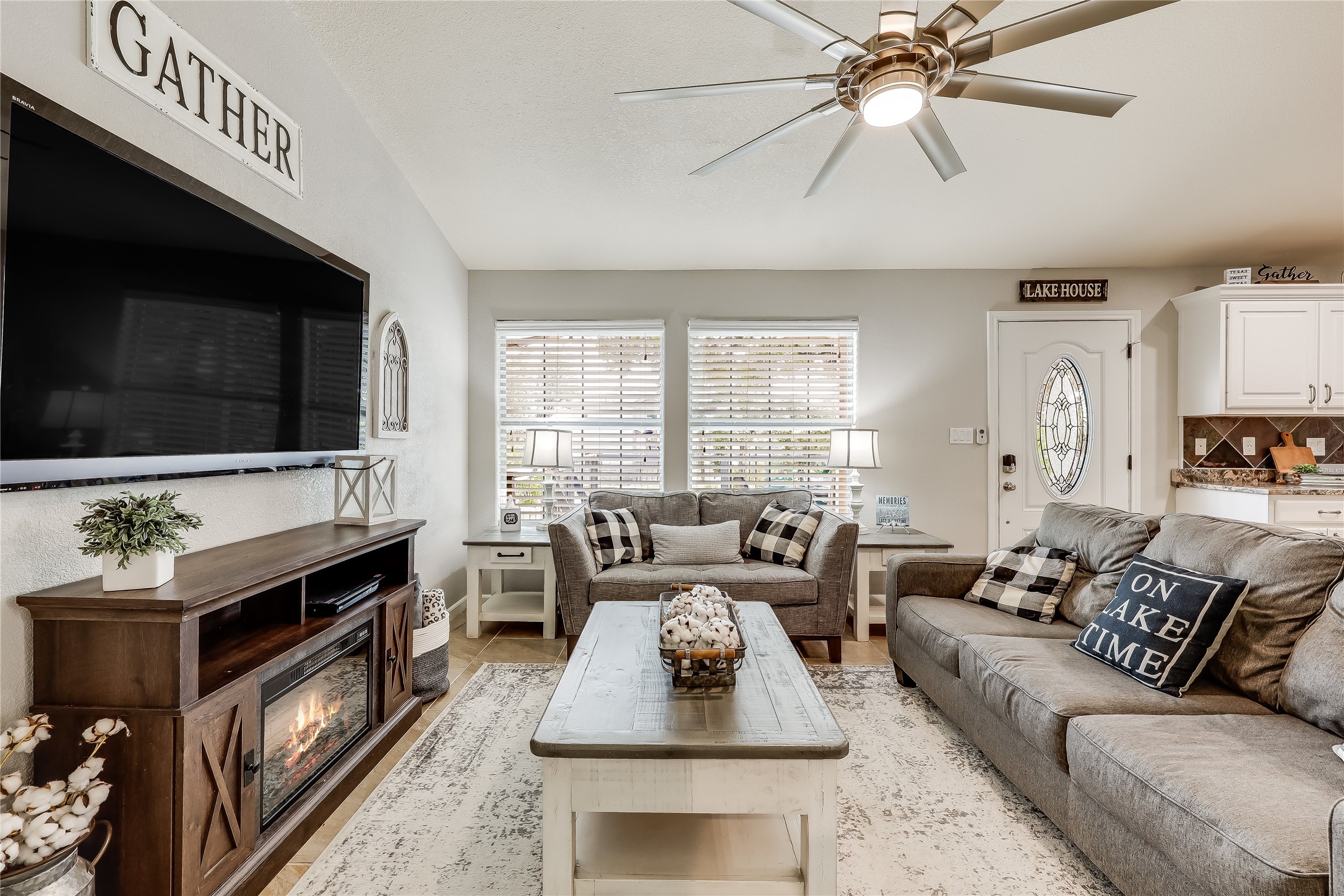 426 Summit Ridge Drive North Point Venture, TX 78645 - Photo 9 of 28 a living room with furniture and a flat screen tv