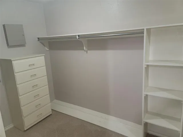 a view of an empty walk in closet