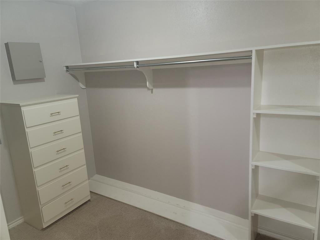 5719 Encore Drive Dallas, TX 75240 - Photo 18 of 21 a view of an empty walk in closet